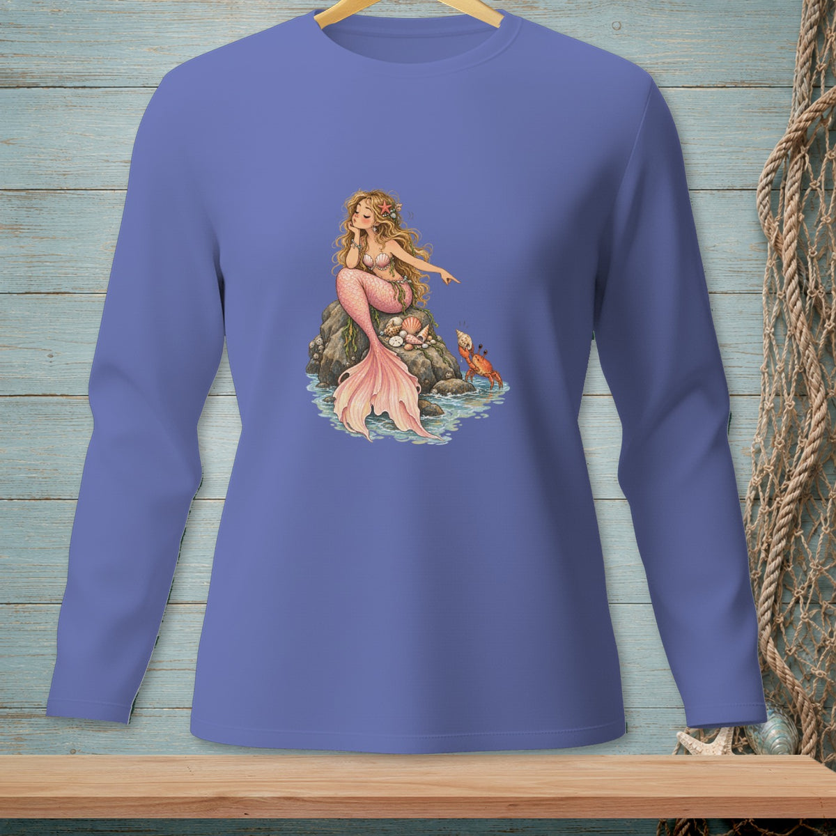 Long-sleeve shirt with a purple t-shirt featuring a blonde mermaid on a rock.