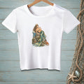 White t-shirt with a mermaid illustration sitting on rocks with a crab and starfish.