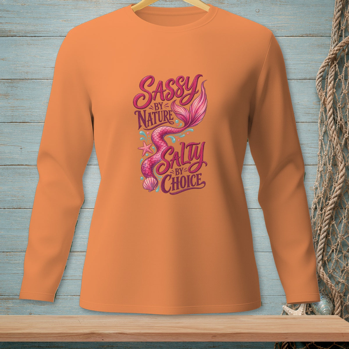 Orange long-sleeve shirt with "Sassy by Nature, Salty by Choice" and a pink mermaid tail.