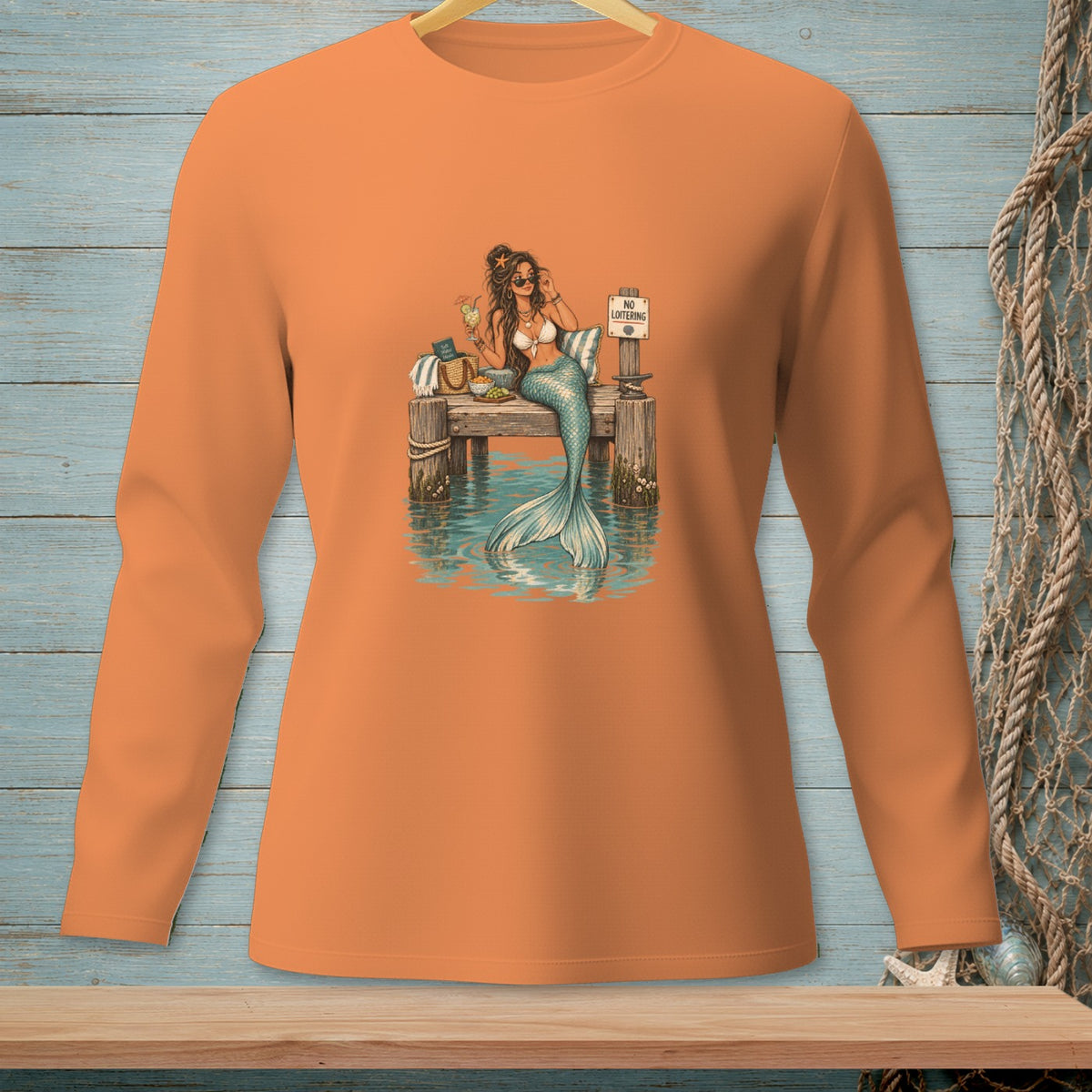 Mermaid on a dock with a drink and a "No Loitering" sign.