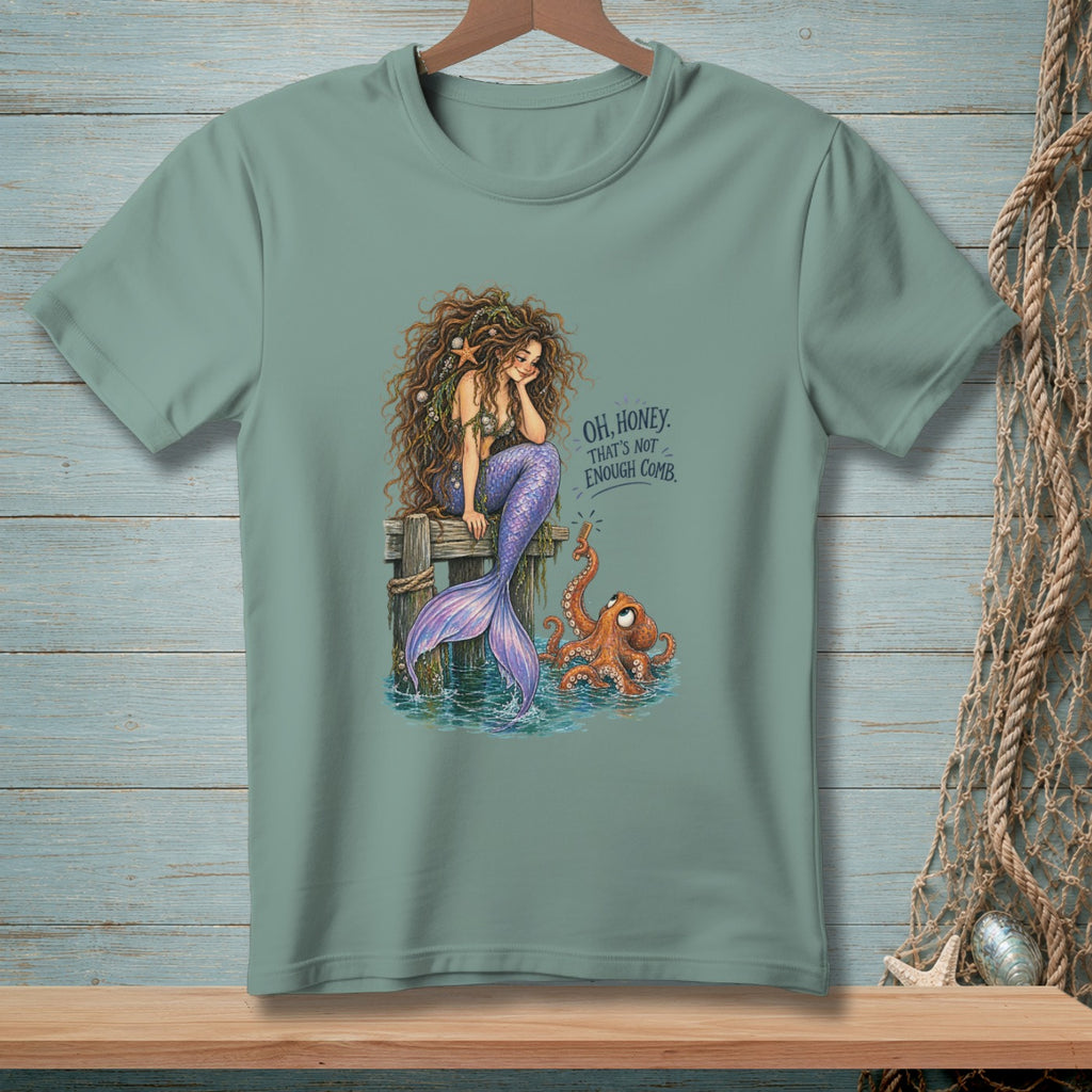 Mermaid with long, curly hair sitting on a dock with an octopus and the text "OH, HONEY. THAT'S NOT ENOUGH COMB."