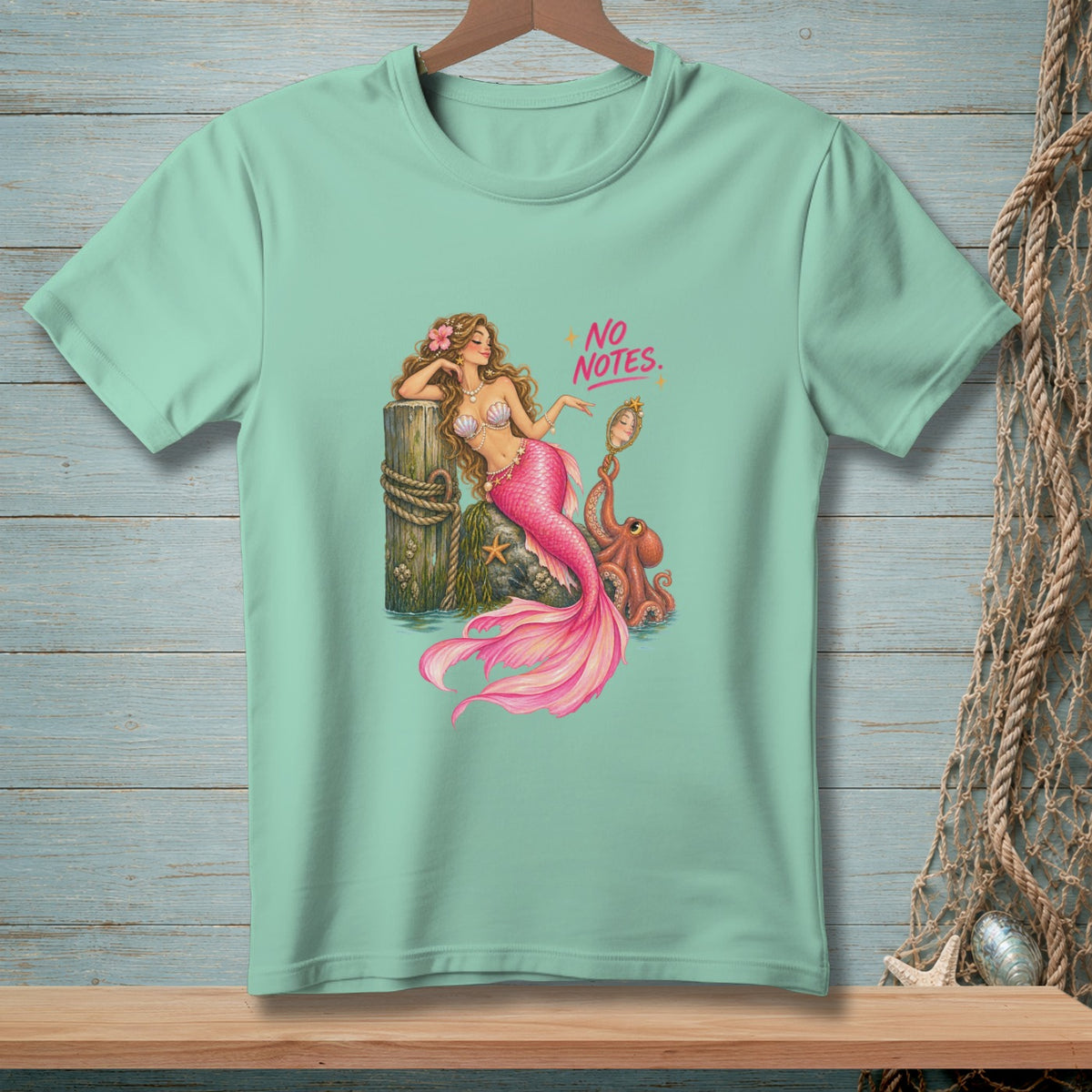 Mermaid with octopus and mirror, text "NO NOTES." printed on a seafoam green t-shirt.