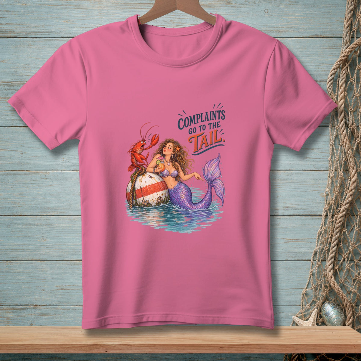 Pink t-shirt with mermaid and lobster text "Complaints go to the tail".