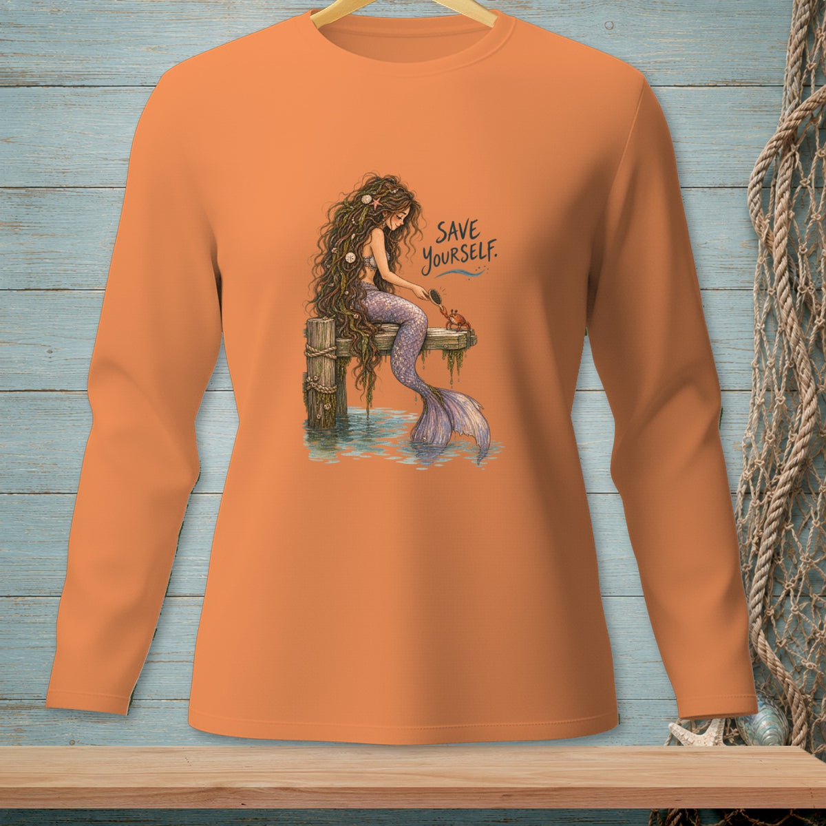 Orange long-sleeve shirt with a mermaid artwork and the text "SAVE YOURSELF."