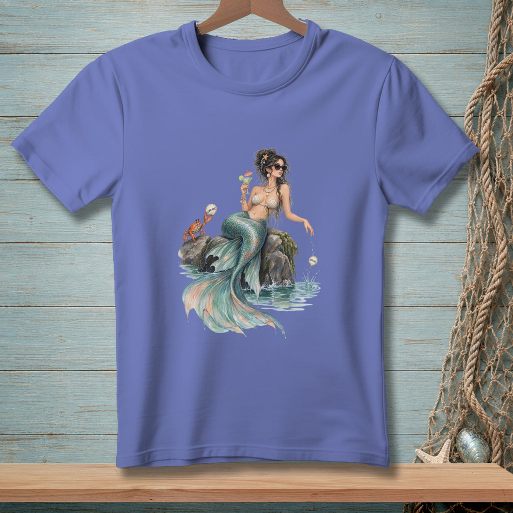 Illustration of a mermaid with sunglasses sitting on rocks, holding a drink, with a crab.