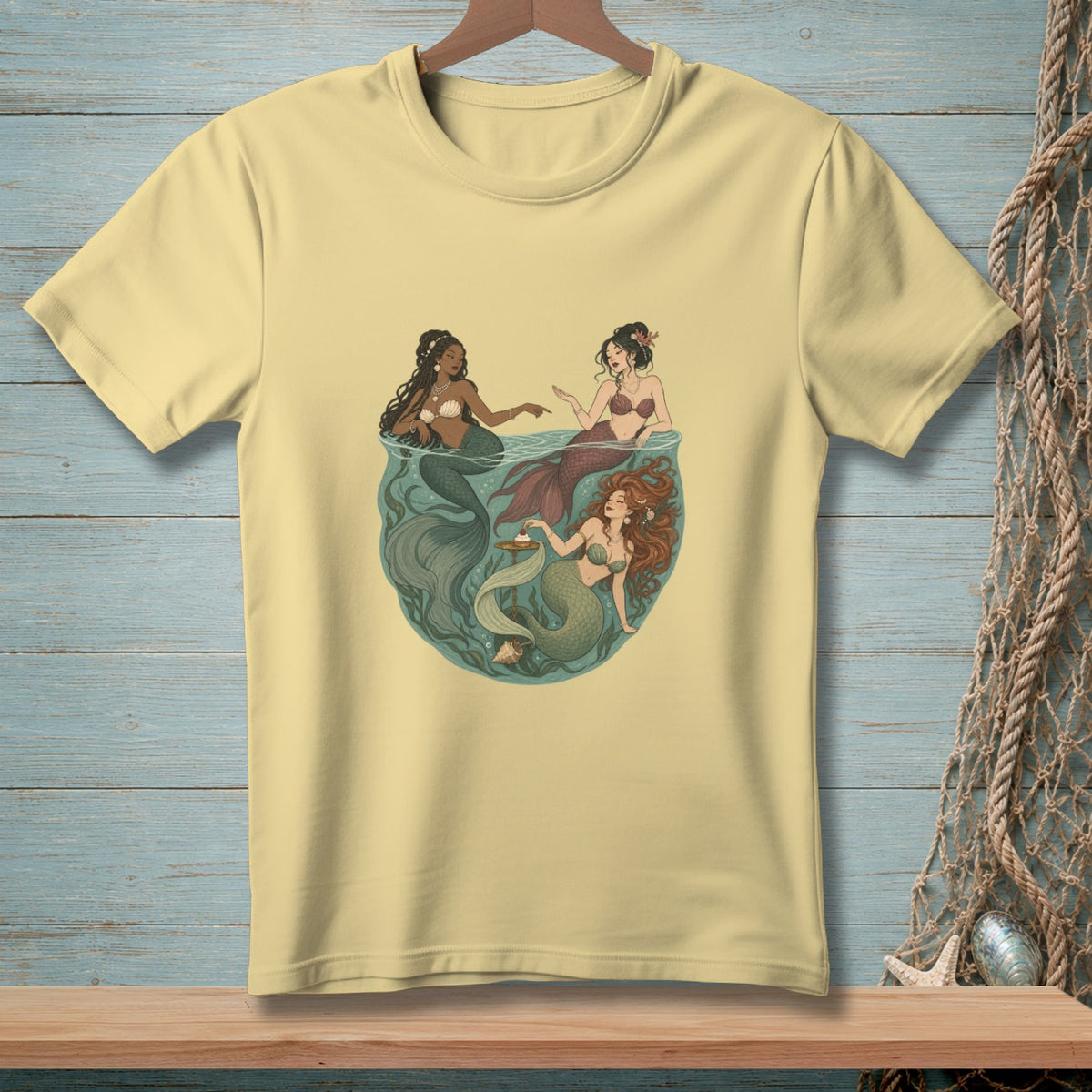 Three mermaids with different colored tails and skin tones swim in a circular underwater scene.