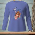 Mermaid holding cocktails with a seagull, on a lavender long-sleeve shirt.