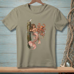 Mermaid and octopus artwork on a tan t-shirt with nautical background.