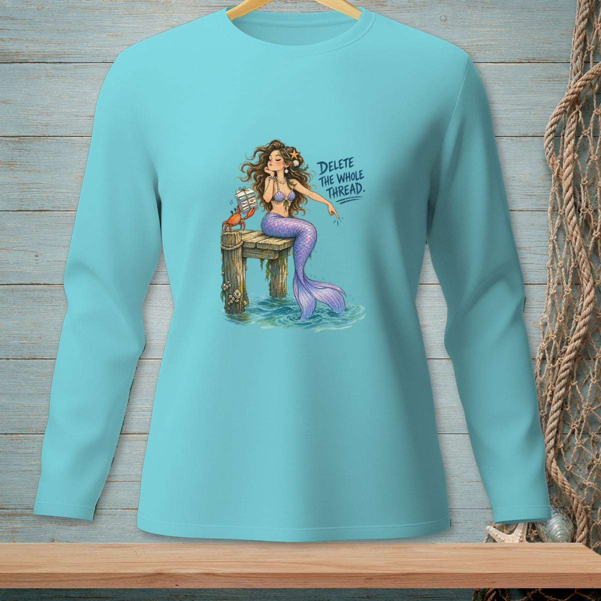 Mermaid with a crab and book on a dock, text "Delete the whole thread".