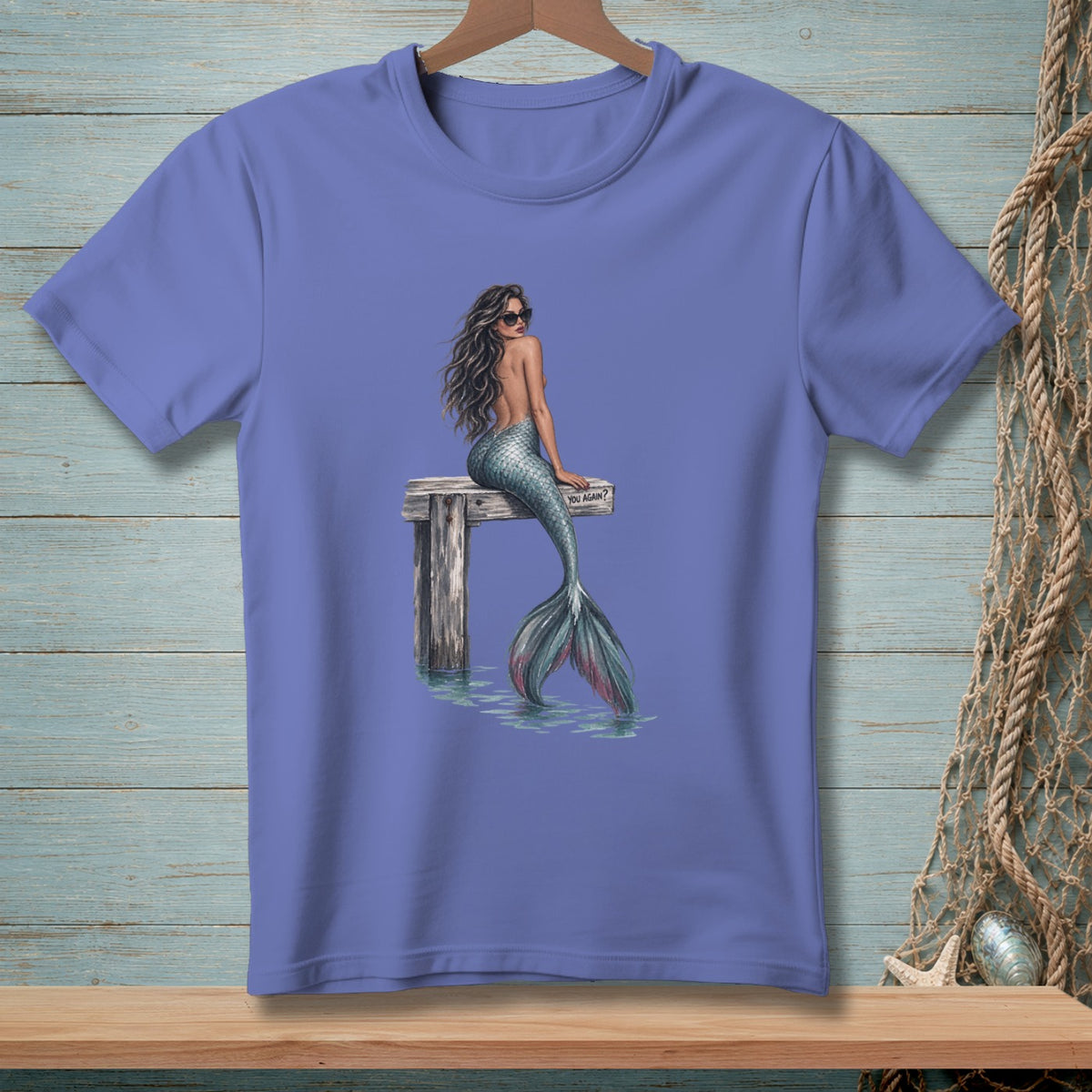 Mermaid with sunglasses sits on a pier with a "YOU AGAIN?" sign.