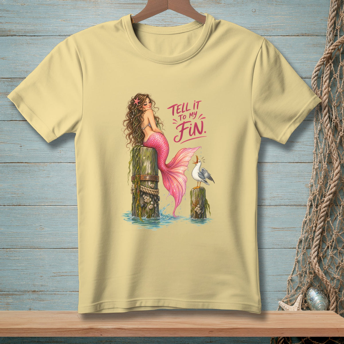 Mermaid with pink tail and text "Tell it to my fin" with a seagull.