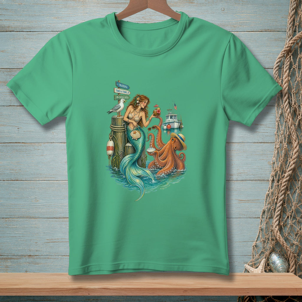 Mermaid, octopus, and seagull scene with a boat and marina sign on a green t-shirt.