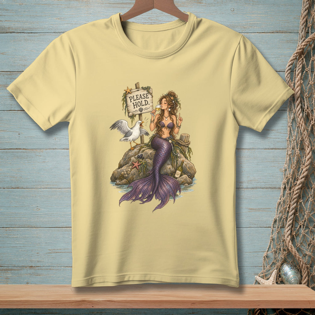 Illustration of a mermaid and seagull by a "PLEASE HOLD." sign on a rock.