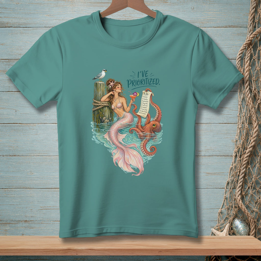 Mermaid with octopus and seagull on post, text "I'VE PRIORITIZED."