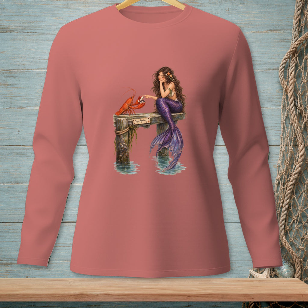 Mermaid sitting on pier with lobster, text "Try Again".