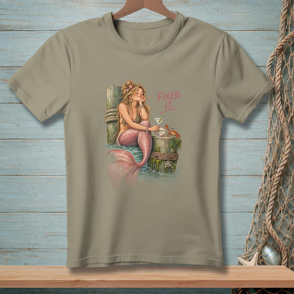 T-shirt graphic featuring a mermaid, martini, crab, and text "FIXED IT."