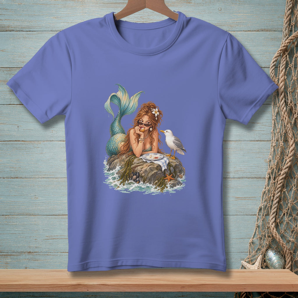 Illustration of a mermaid sitting on a rock with a seagull and food.