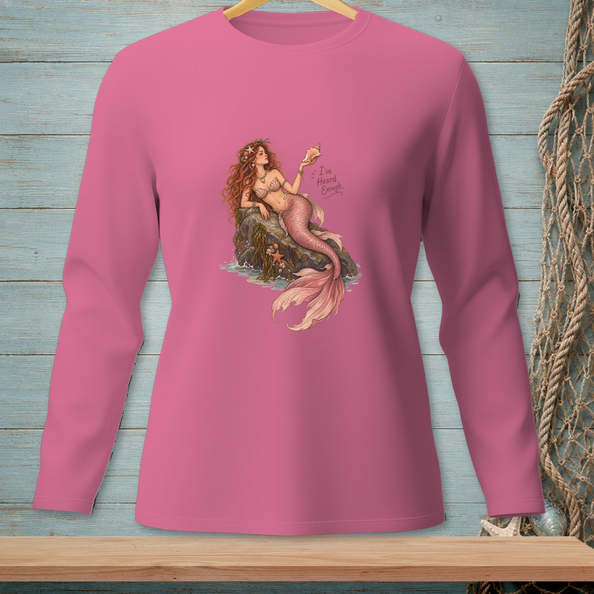 Pink long-sleeve shirt with mermaid graphic and "I've Heard Enough" text.