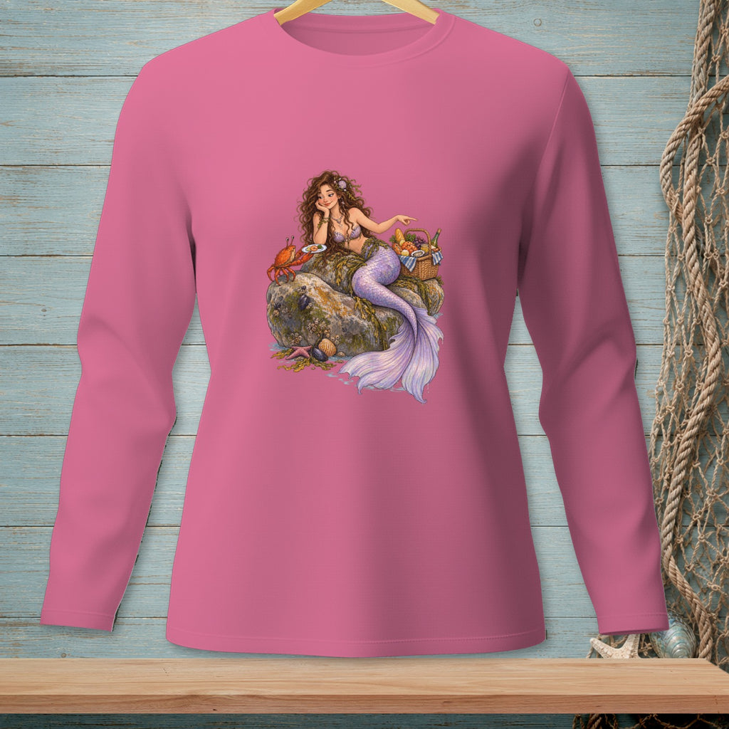 Pink long-sleeve shirt with a mermaid sitting on rocks with a crab and picnic basket.