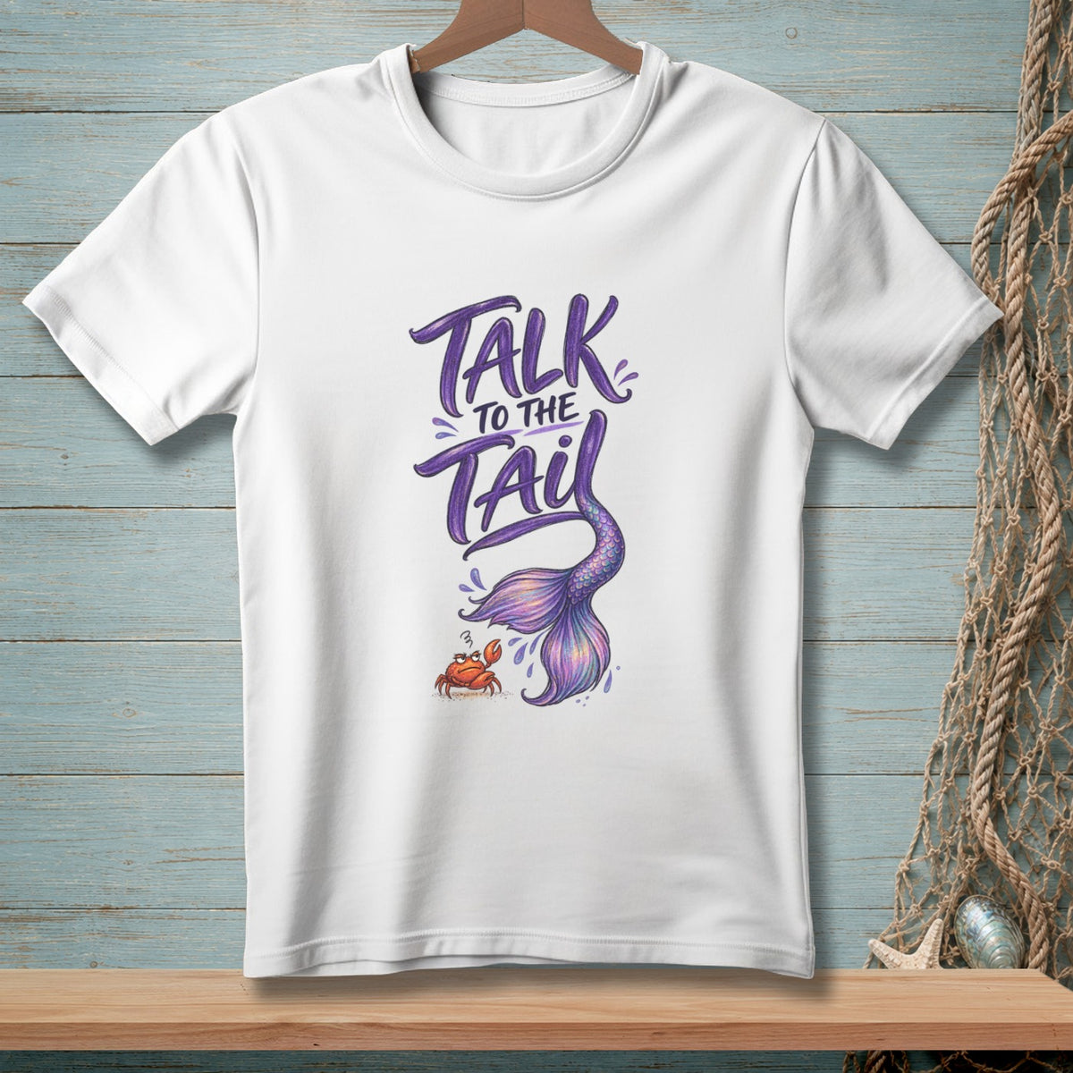 White t-shirt with "Talk to the Tail" text, mermaid tail, and crab graphic.