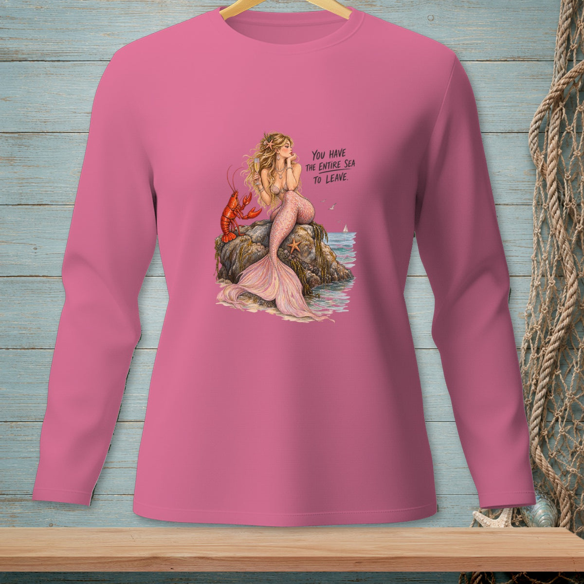 Mermaid and lobster on a rock with text "You have the entire sea to leave."