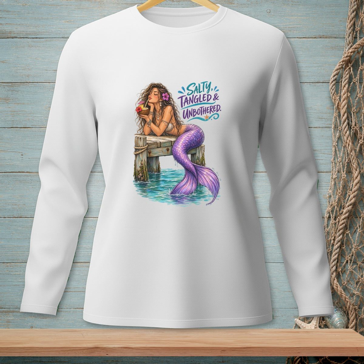 Mermaid on pier with drink, "Salty, Tangled & Unbothered" text.