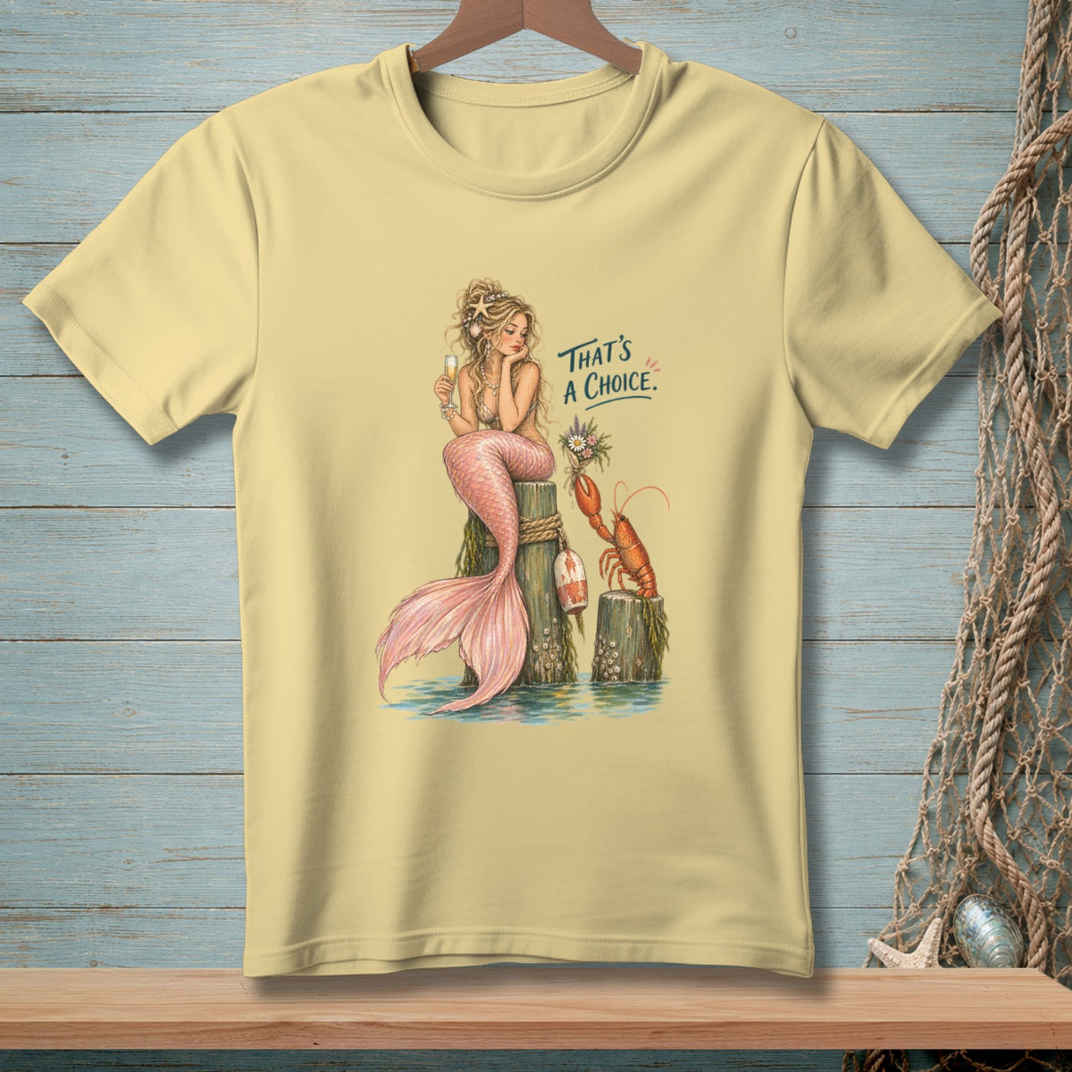 Light yellow t-shirt with a mermaid, lobster, and text "That's a choice."