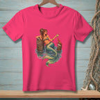 Pink t-shirt with a mermaid holding a drink and a crab.