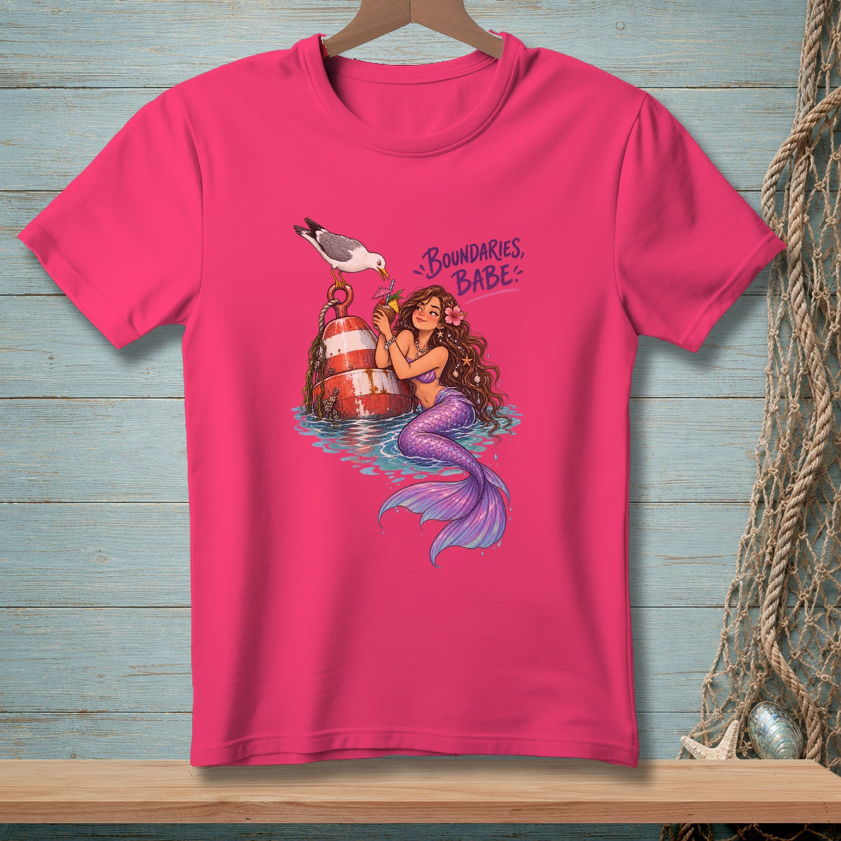 Pink t-shirt with mermaid, buoy, seagull, and "Boundaries, Babe" text.