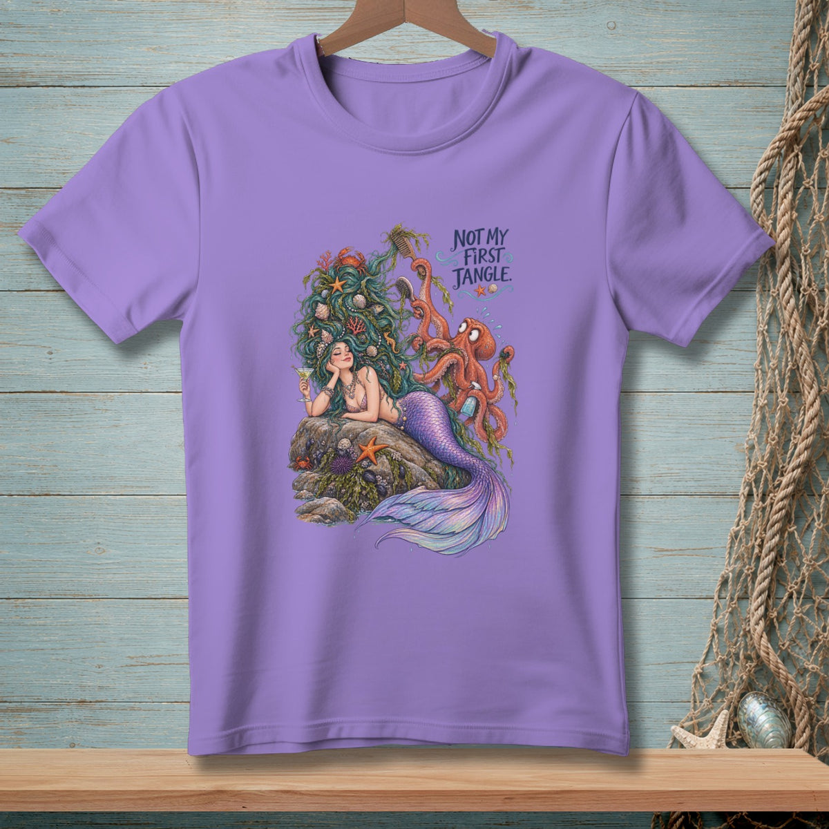 Lavender t-shirt with mermaid, octopus, and text "Not My First Jangle".