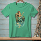Green t-shirt with a mermaid holding a drink, sitting by a dock post with a crab.