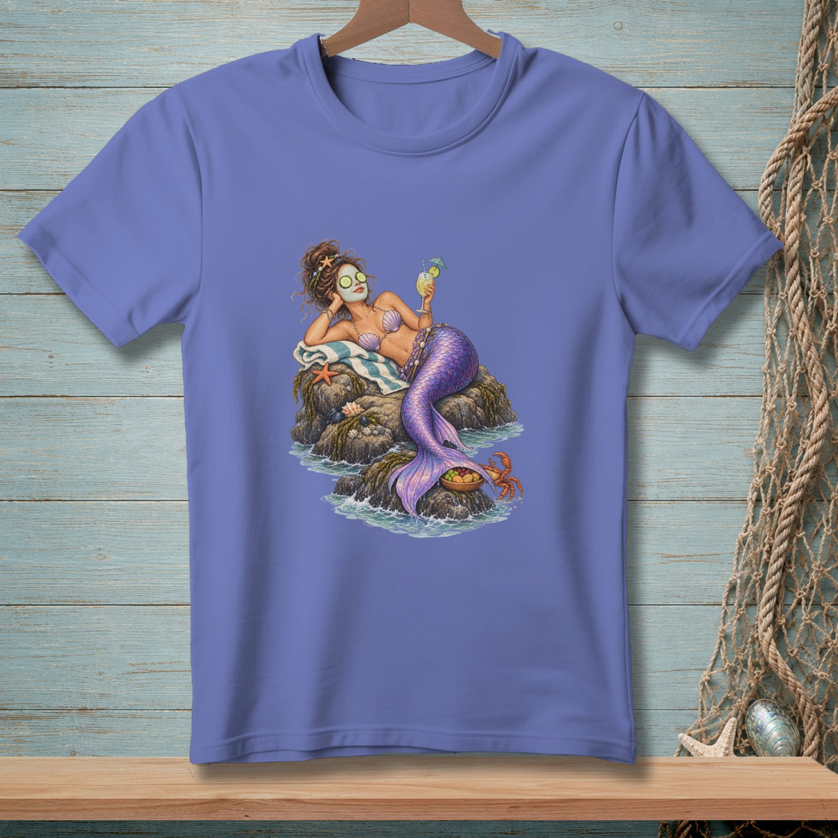 Mermaid with cucumber eyes, face mask, and drink on a rock with a crab.