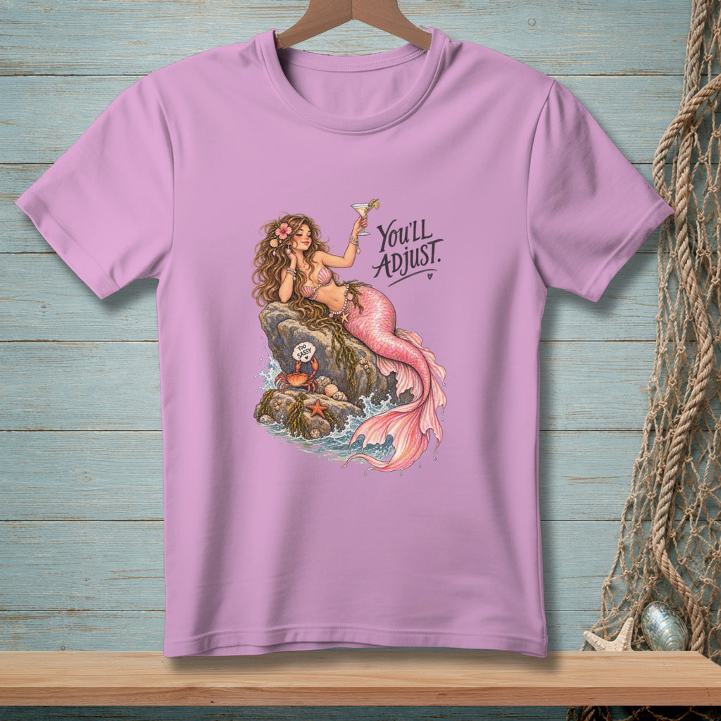 Pink t-shirt with a mermaid, crab, and text "You'll ADJUST."