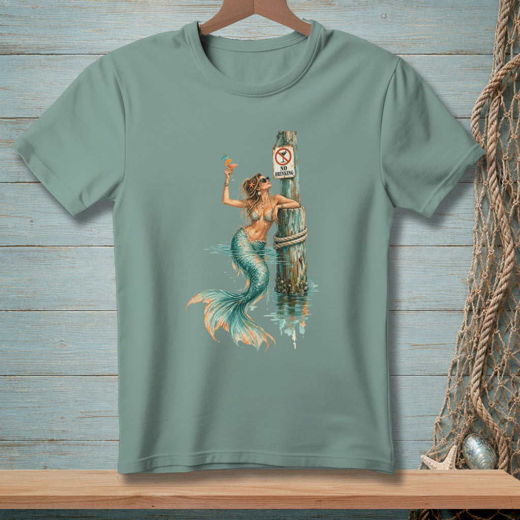 Mermaid with a drink leans on a pole with a "No Drinking" sign.