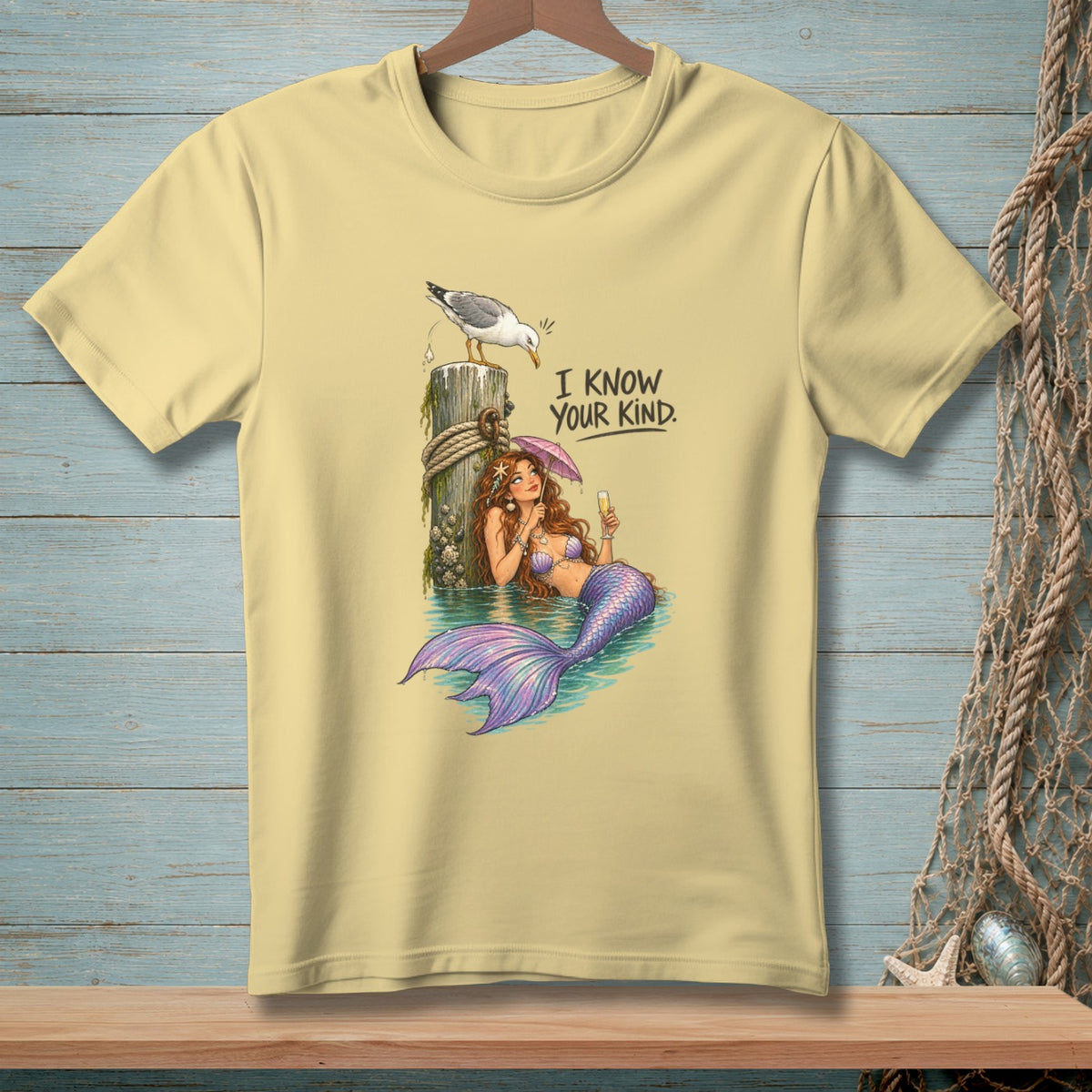 Light yellow t-shirt with a mermaid and seagull graphic, saying "I know your kind."