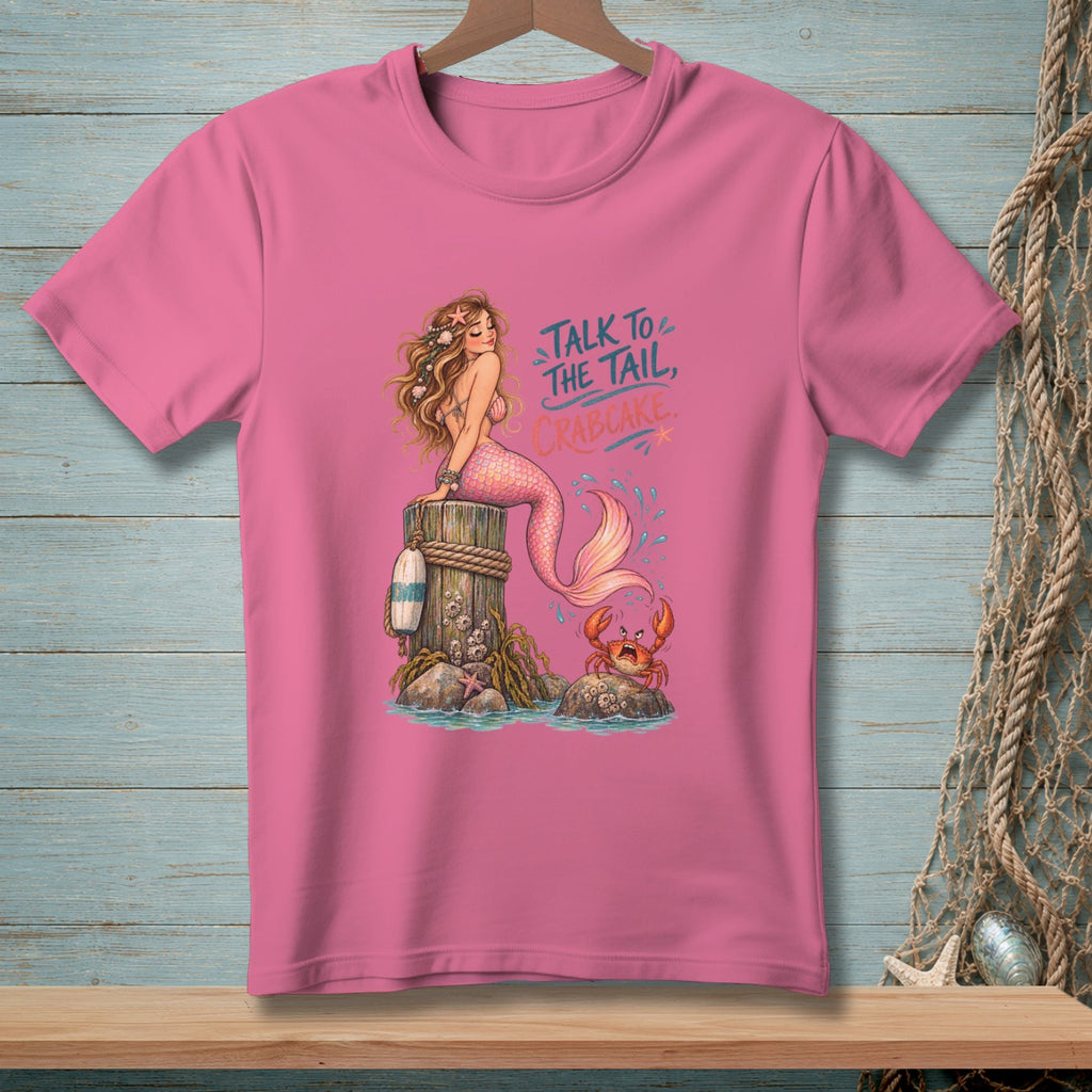 Mermaid sitting on a post with crab and text "Talk to the Tail, Crabcake."