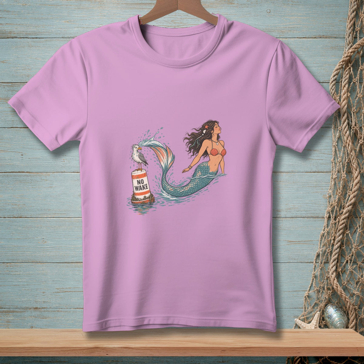 Pink t-shirt with mermaid and seagull on "NO WAKE" buoy illustration.