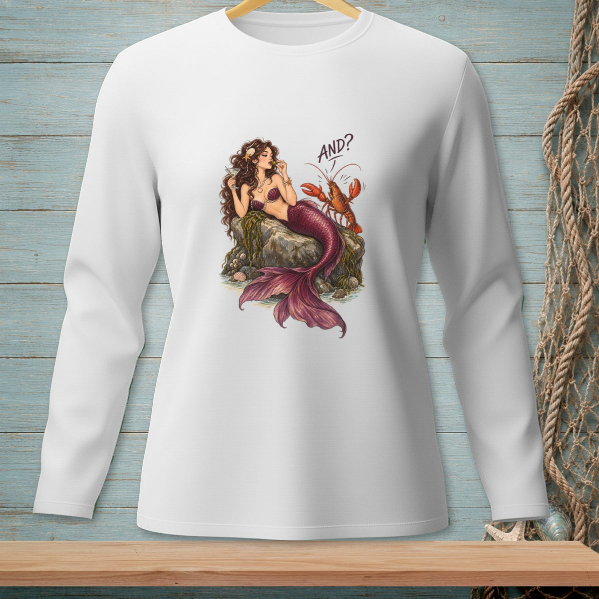 Mermaid with lobster and martini glass on rocks, text reads "AND?".