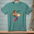 Mermaid and pufferfish with text "That's a lot of drama per inch."
