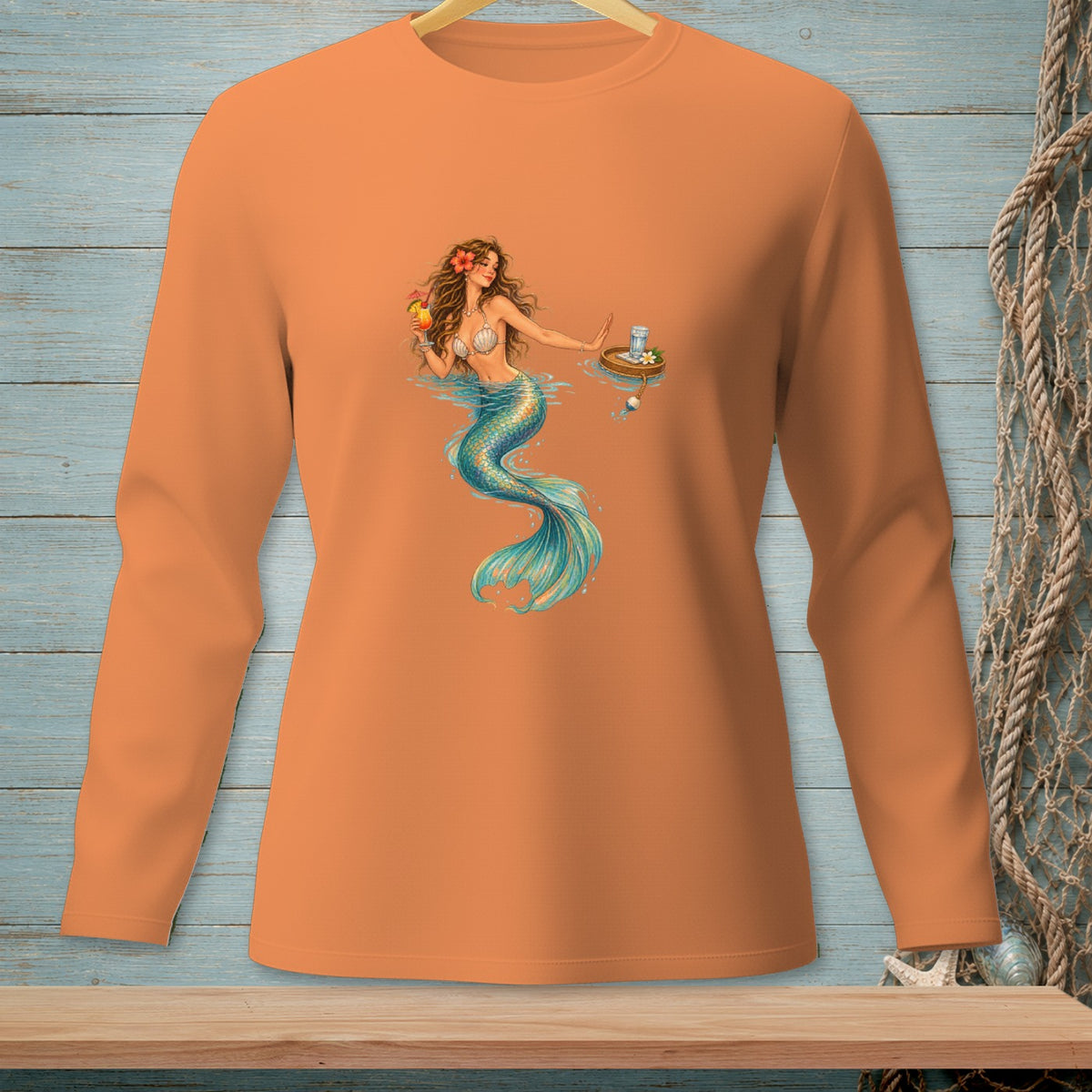 Long sleeve orange shirt with mermaid illustration holding a drink and a drink tray.