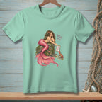 Mermaid with pink tail lounging on rock, showing a crab a clipboard with "Expectations" and "Joy" listed.