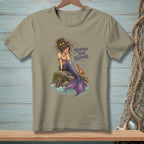 T-shirt with a mermaid sitting on a rock and the text "Mermaid Hair Happens."