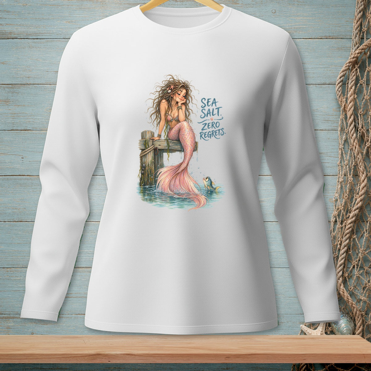 Long-sleeved shirt with mermaid design and text "SEA SALT ZERO REGRETS".