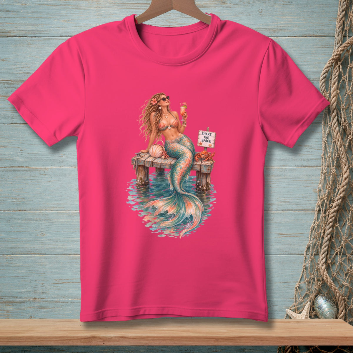 Mermaid holding drink on dock with sign saying "Share the Space" and a crab.