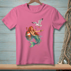 Pink t-shirt with a mermaid and seagull illustration, featuring a buoy in water.