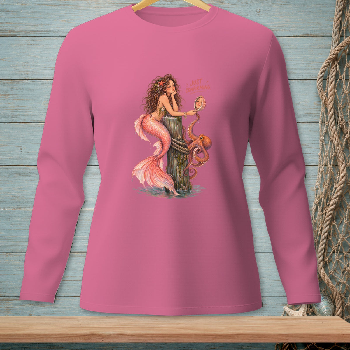 Pink long-sleeve shirt with mermaid, octopus, and "Just Confirming" text.