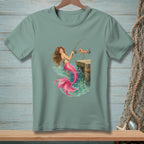 Green t-shirt with mermaid fishing from a dock with a bright pink tail.