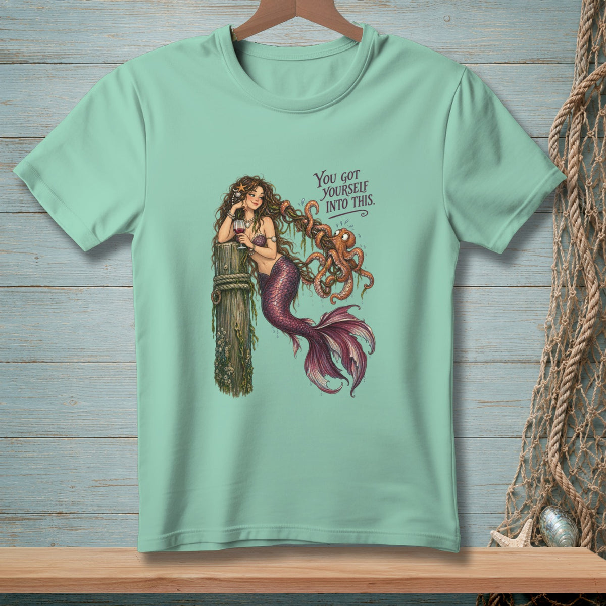 Mint t-shirt with mermaid tangled in octopus tentacles, text reads "You got yourself into this."