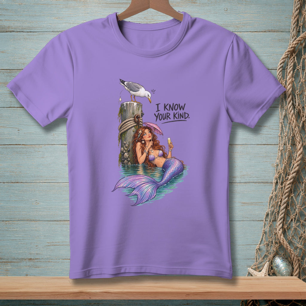 Purple t-shirt with a mermaid and seagull graphic and the text "I KNOW YOUR KIND."
