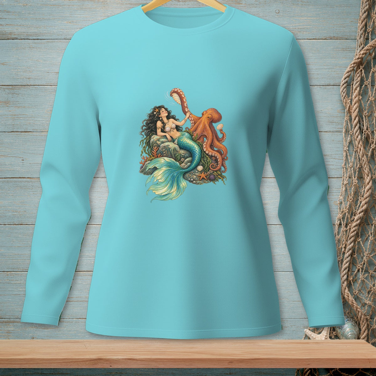 Mermaid with octopus graphic on a light blue long-sleeve t-shirt.